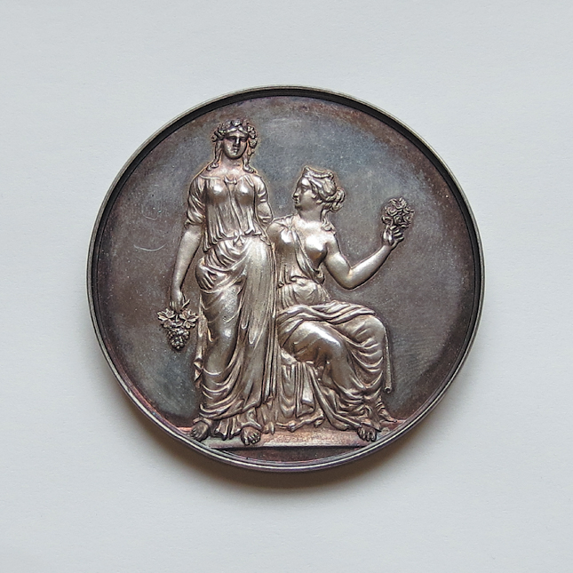 Photo of front side of silver medal