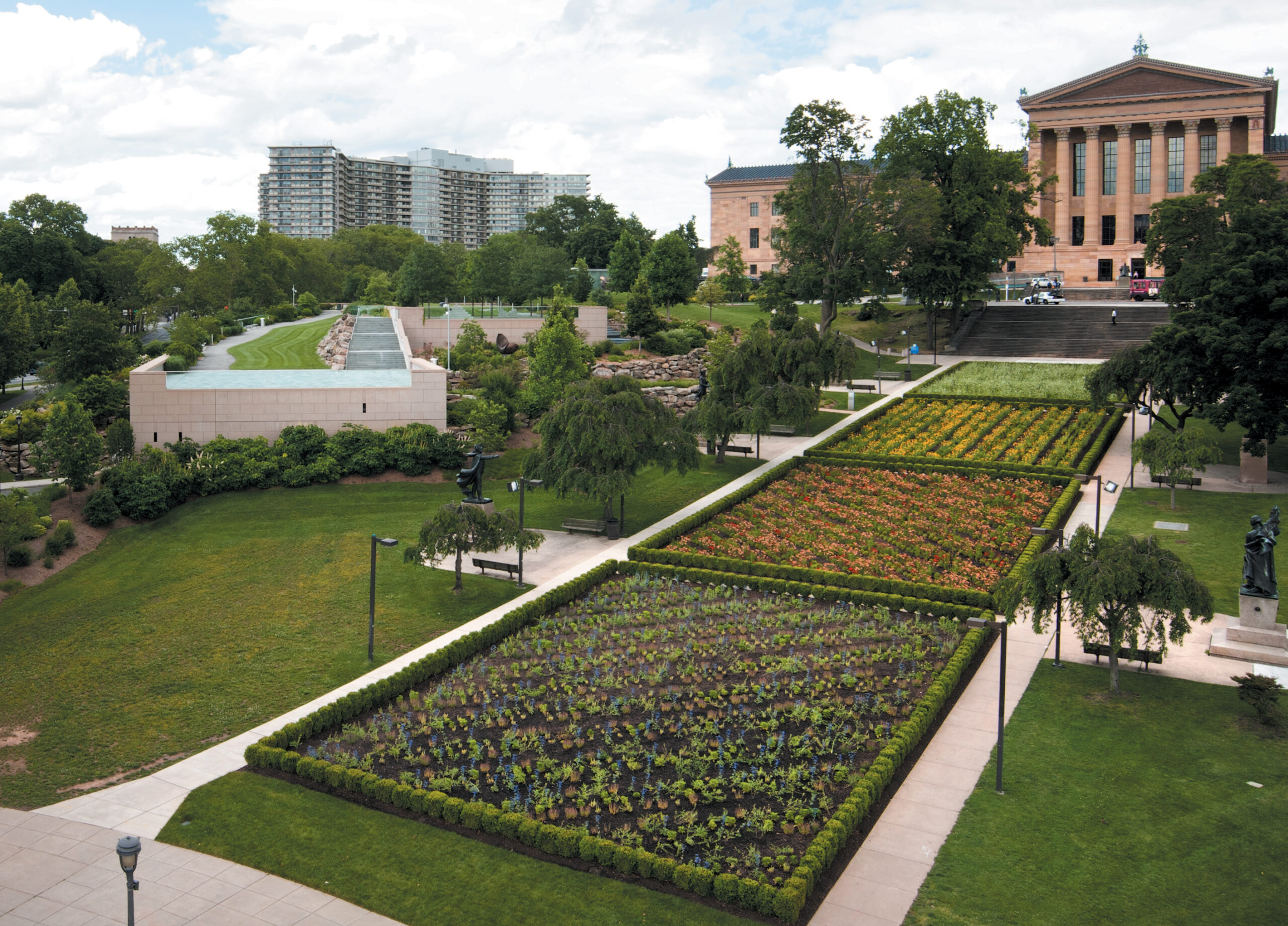 A color image of four large flower beds in a row.