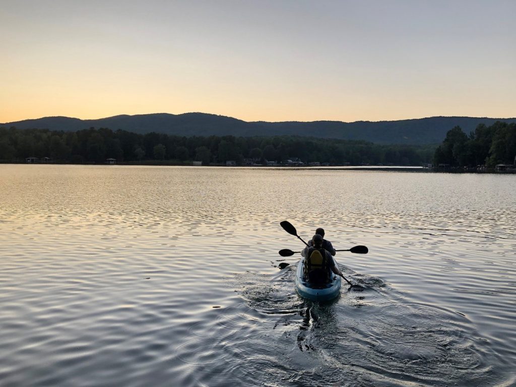 Andrew Gapinski and Kang Wang canoe on Lake Cherokee