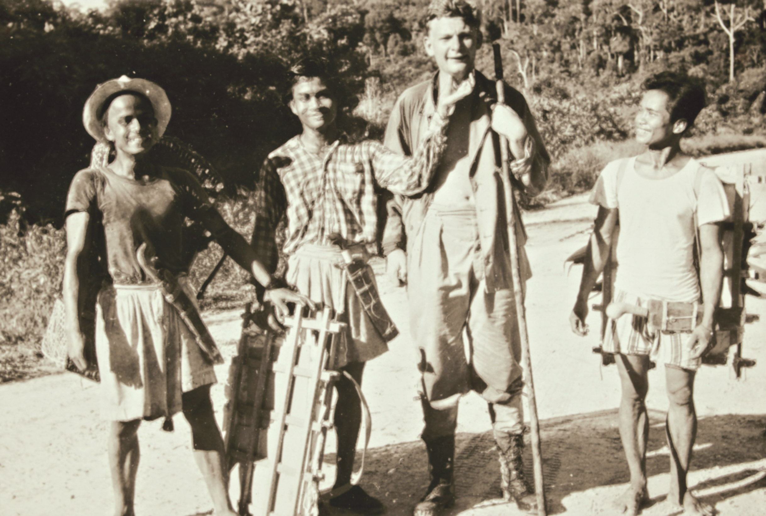 Photo of four men standing in a row