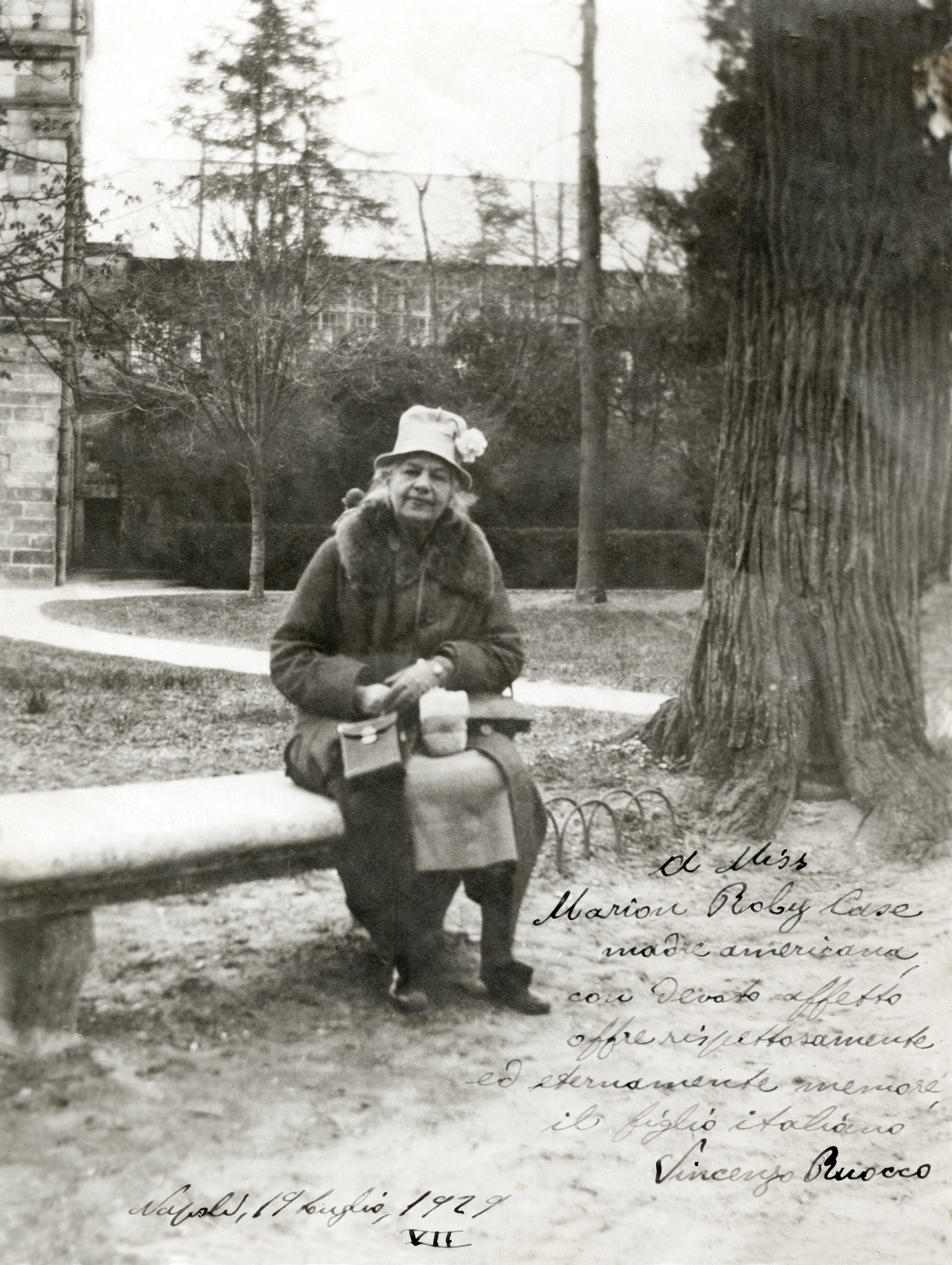 Black-and-white photograph of Marian Roby Case sitting. With hand-written-inscription in lower right corner.