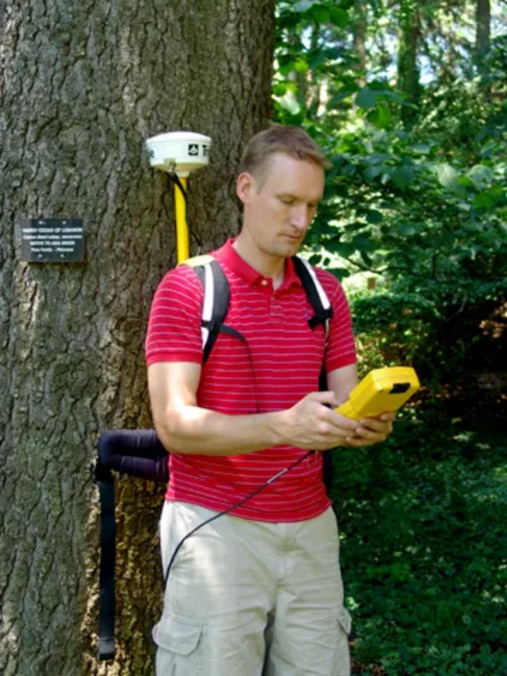 Plant Records Manager Kyle Port uses a Trimble handheld GIS device to map plant collections