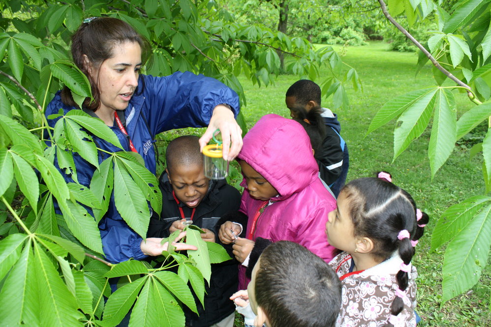 Volunteers help children explore the natural world. Photographs by Jon Hetman, Nancy Sableski, Kevin Schofield, and Julie Warsowe.