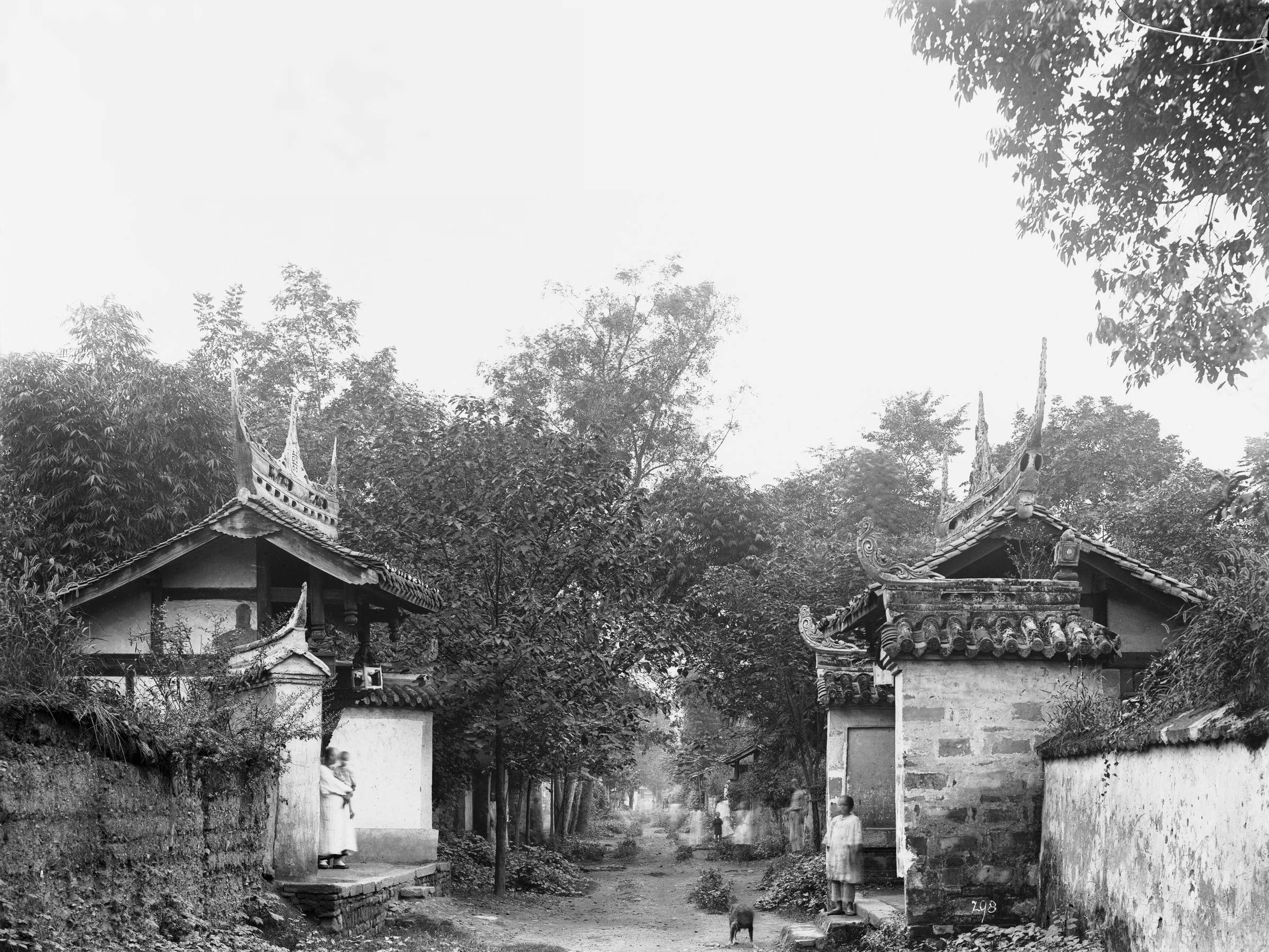 Black-and-white photograph of street in Chinese city