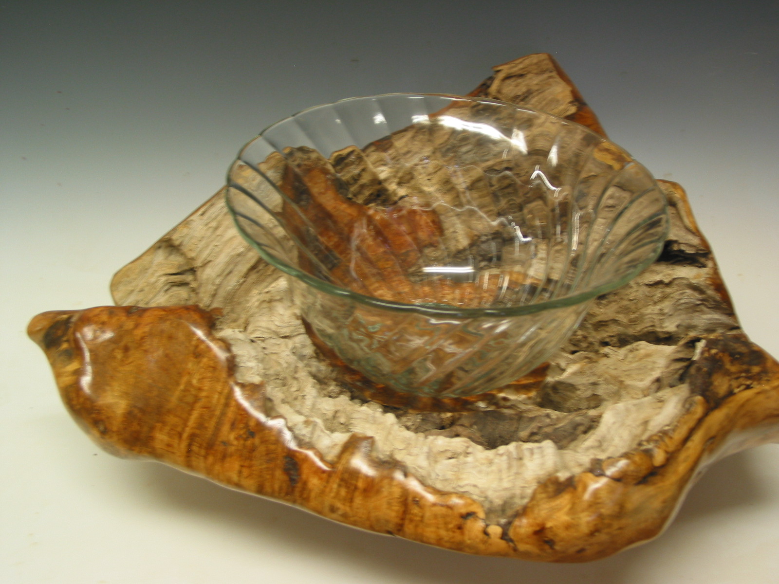 Free form wooden bowl with glass bowl