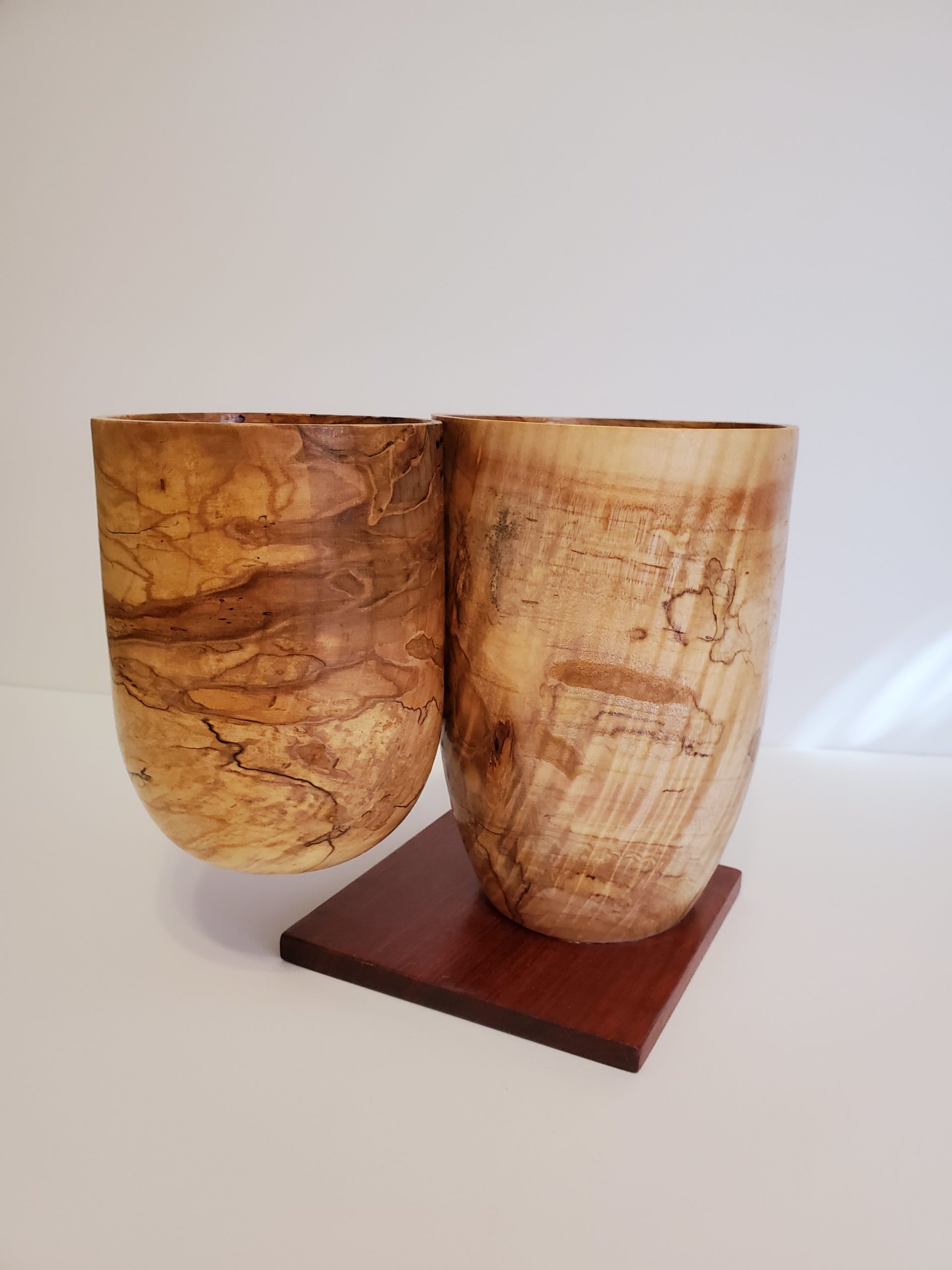 Two wood bowls, fastened side by side