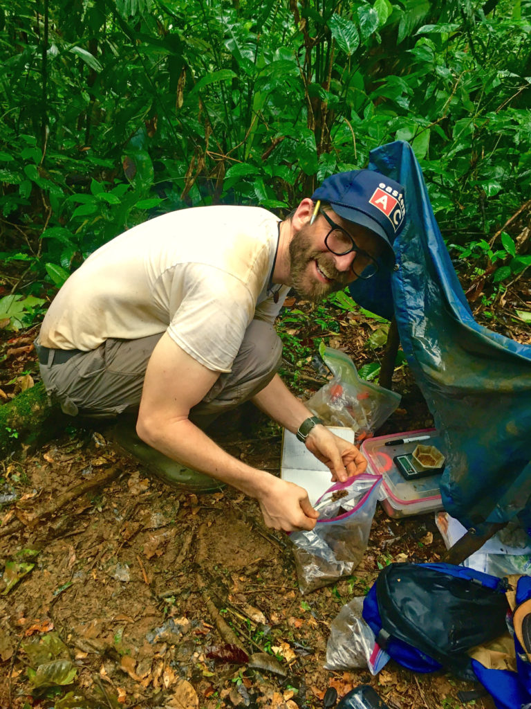 Ben Taylor weighs soils for nutrient analysis in the field