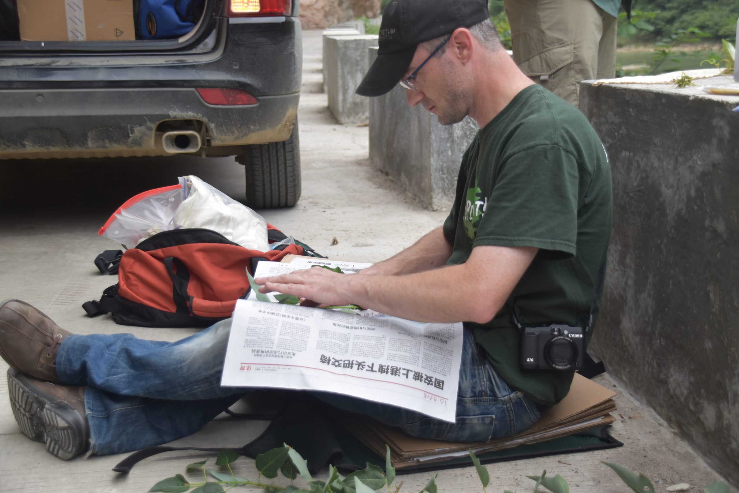 2015 NACPEC member Michael Dosmann prepares plant specimens.