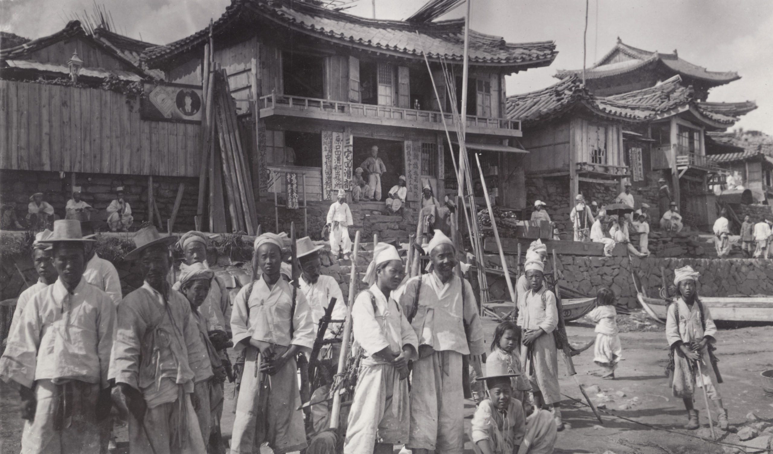 Korea laborers standing at a landing on the Taedong River, Pyongyang, Korea (now North Korea). Photograph by John Jack, September 19, 1905.