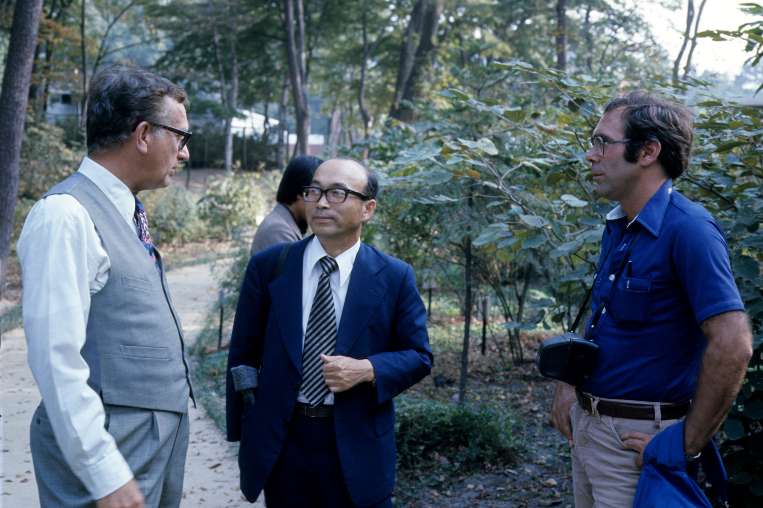 Carl Ferris Miller, Lee Yong-mo, and Richard Weaver photographed by Stephen Spongberg at the Forestry Research Institute Arboretum, Seoul. October 5, 1977.