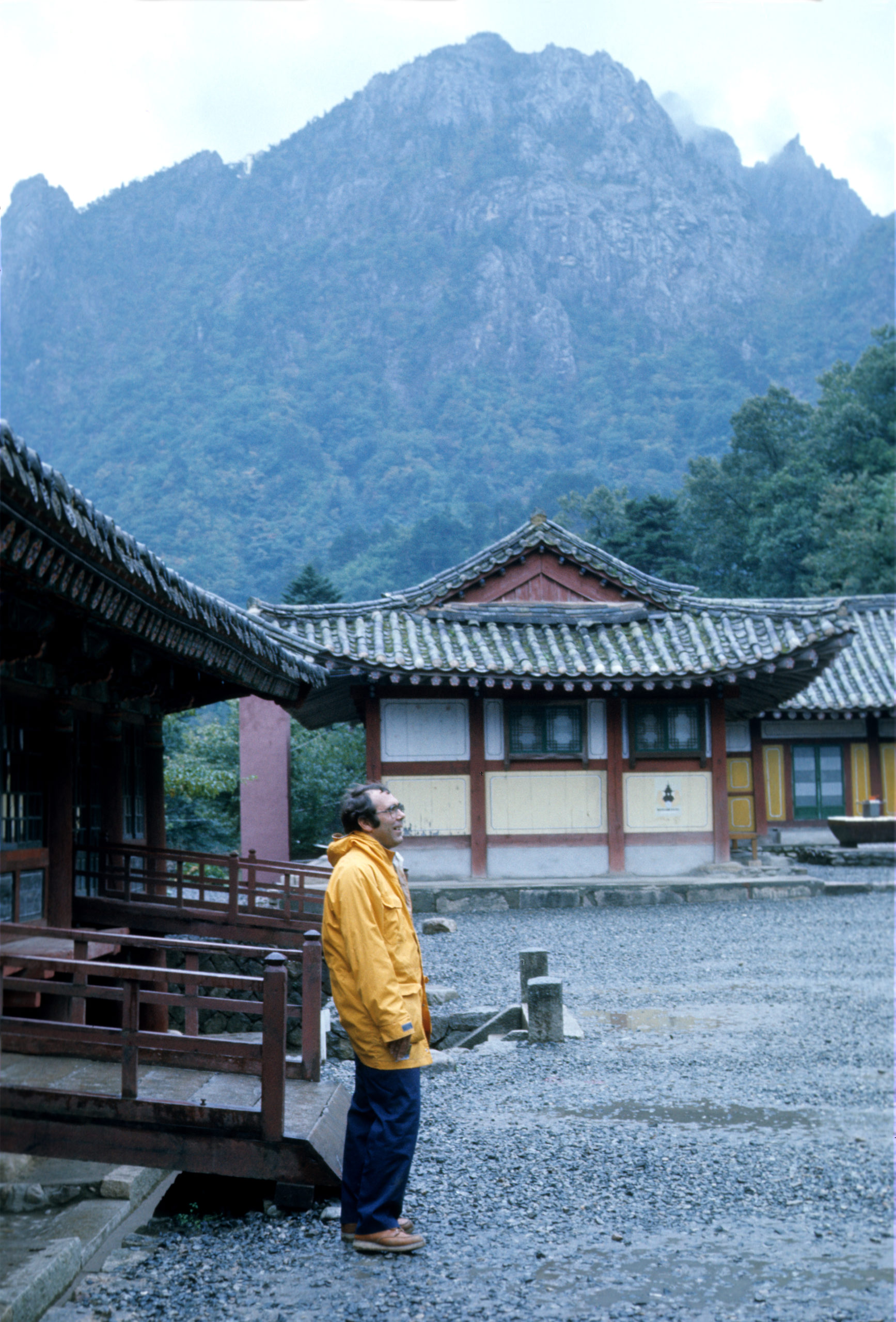 A wet and weary Richard Weaver stands in the courtyard of the temple at the Seoraksan National Park in northeastern South Korea. Photograph by Stephen Spongberg, October 7, 1977.