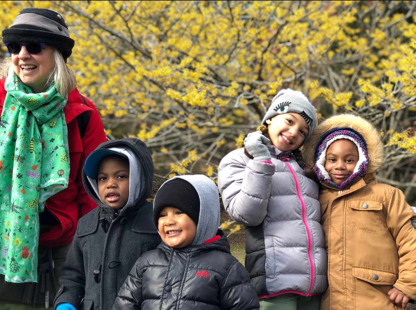 Children enjoy the signs of spring with Nancy Sableski, Manager of Children's Education