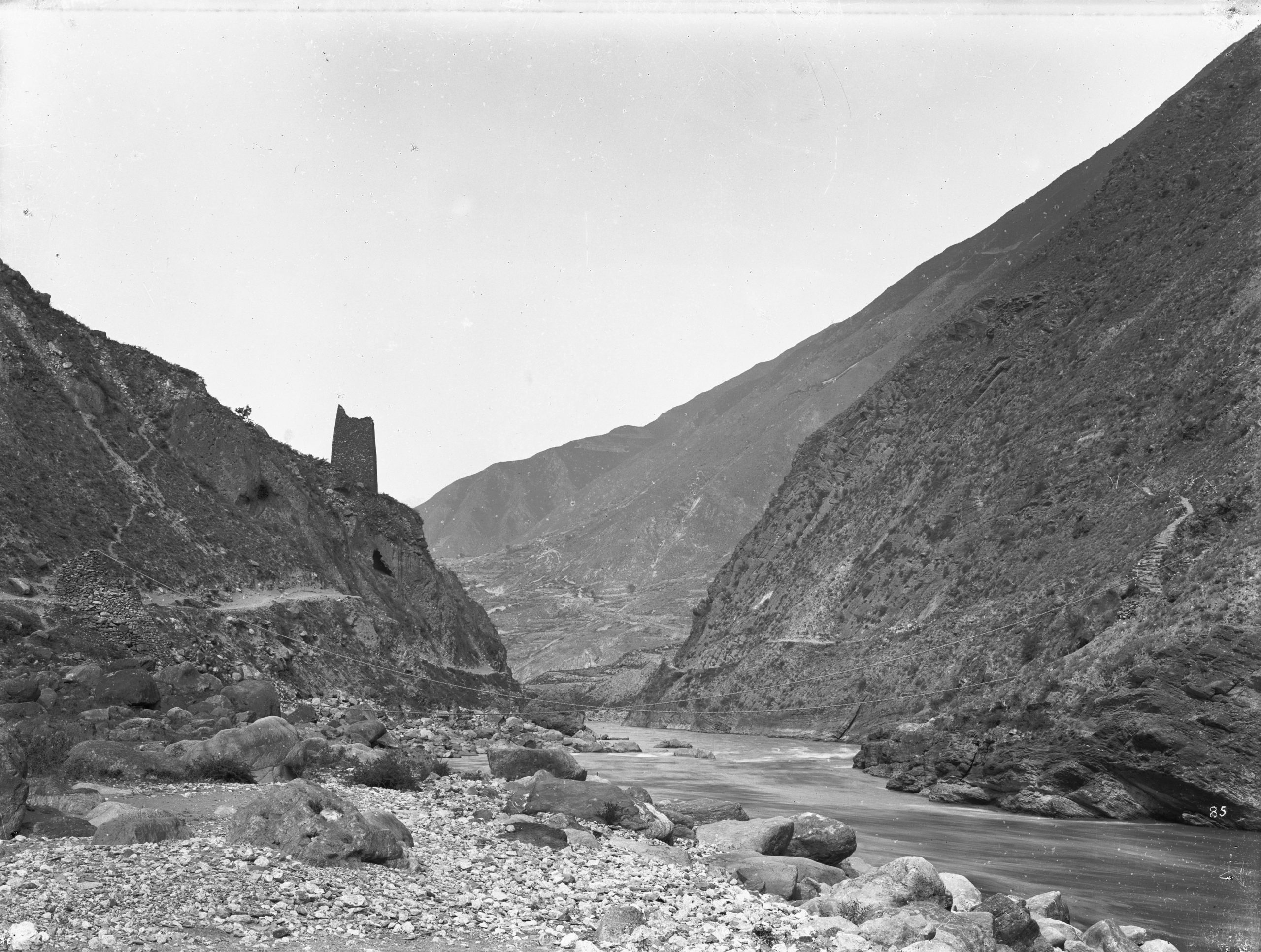 Ernest Wilson photographed this bamboo cable bridge and old watch tower Wenchuan Country, Sichuan in May 1908 at an altitude of 4500 feet (1372 meters).