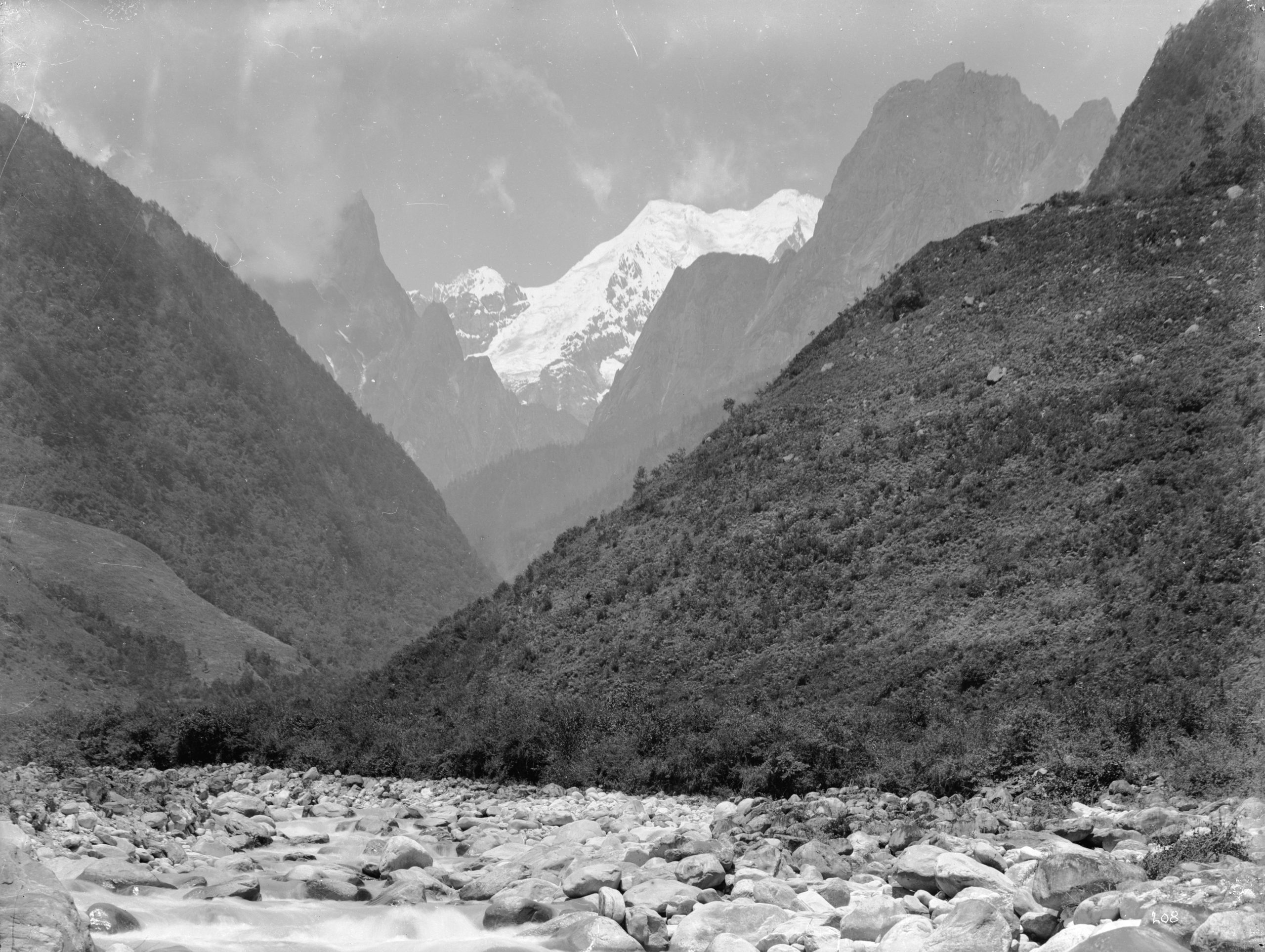 A view of a snow clad peak, 20,000 feet (6096 meters) high southeast of Kangding (Tachien-lu). Photograph by Ernest Wilson, July 1908.