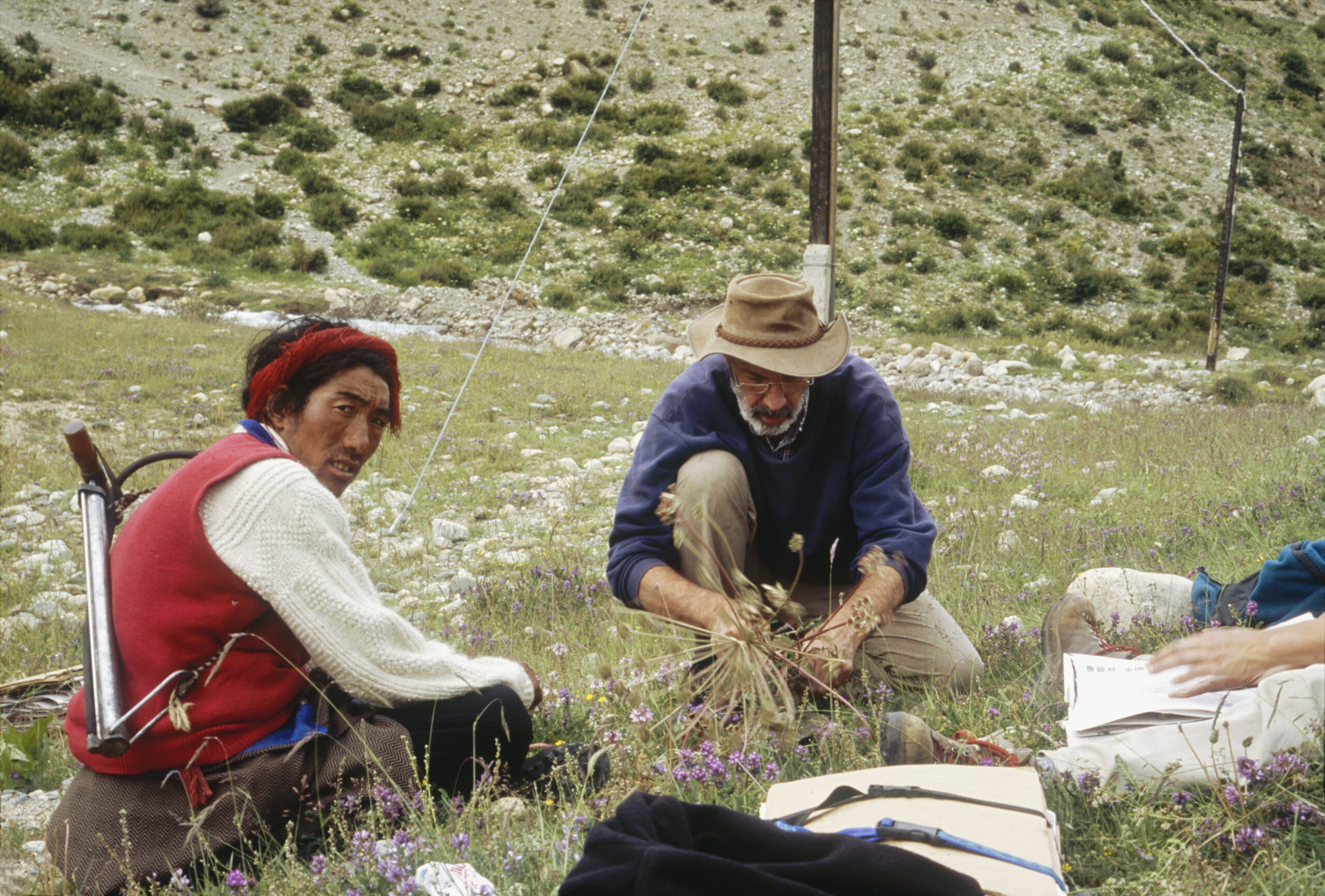 A Tibetan man with bicycle pump watching David Boufford pressing plants east of Anjiu La on Highway 318 from Rawu to Baxoi [Baima], Tibet.