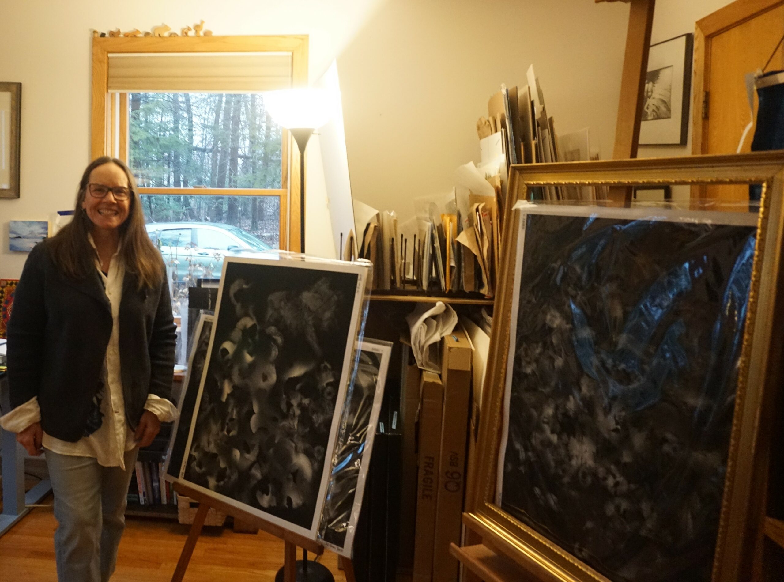 Woman in her art studio with art