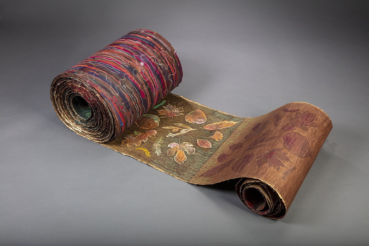 art scroll with prints of leaves and colorful designs