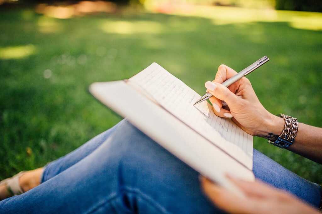 Person writing in a notebook