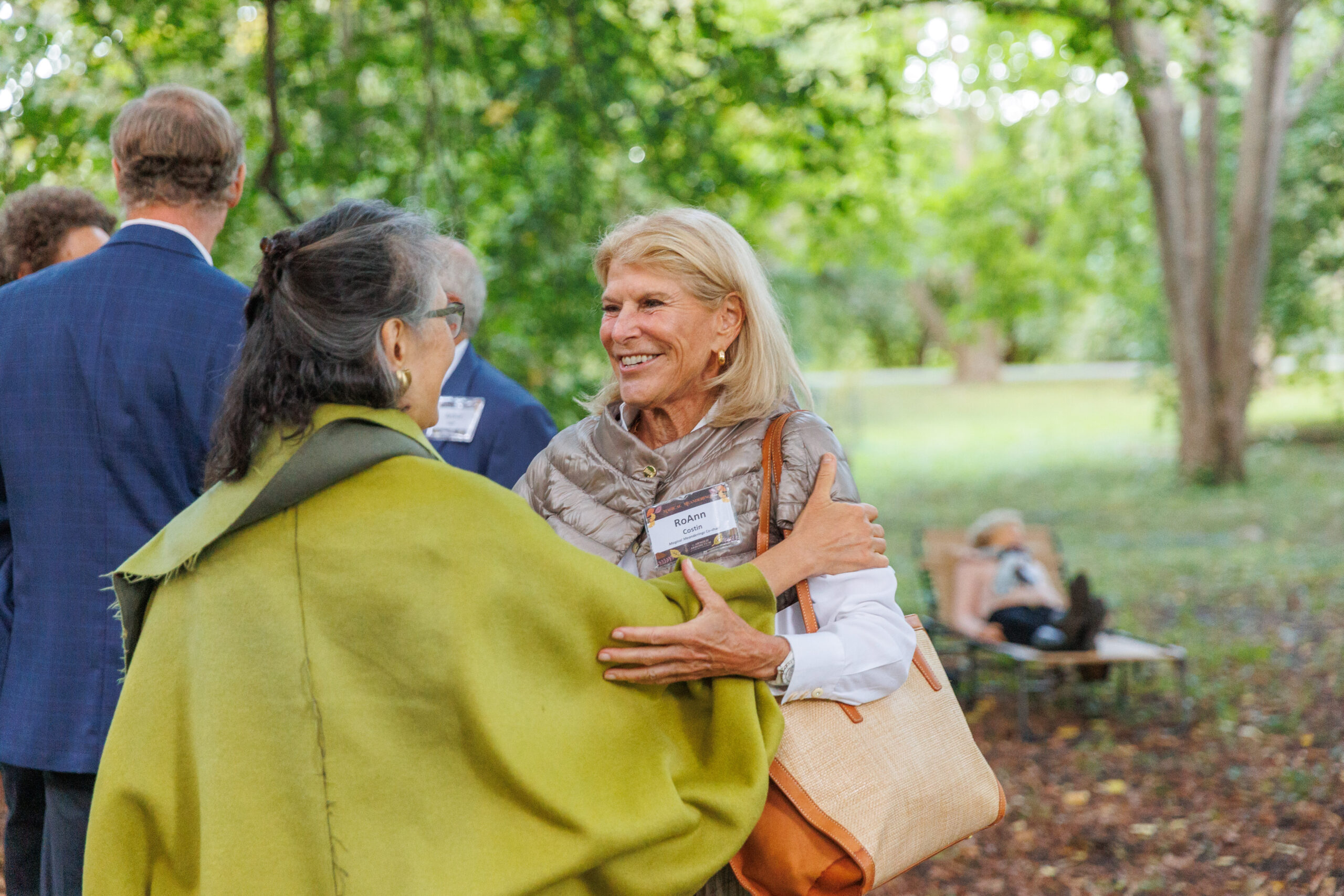 Guests greet one another in the linden collection at Magical Meanderings Autumn Dinner, September 19, 2023