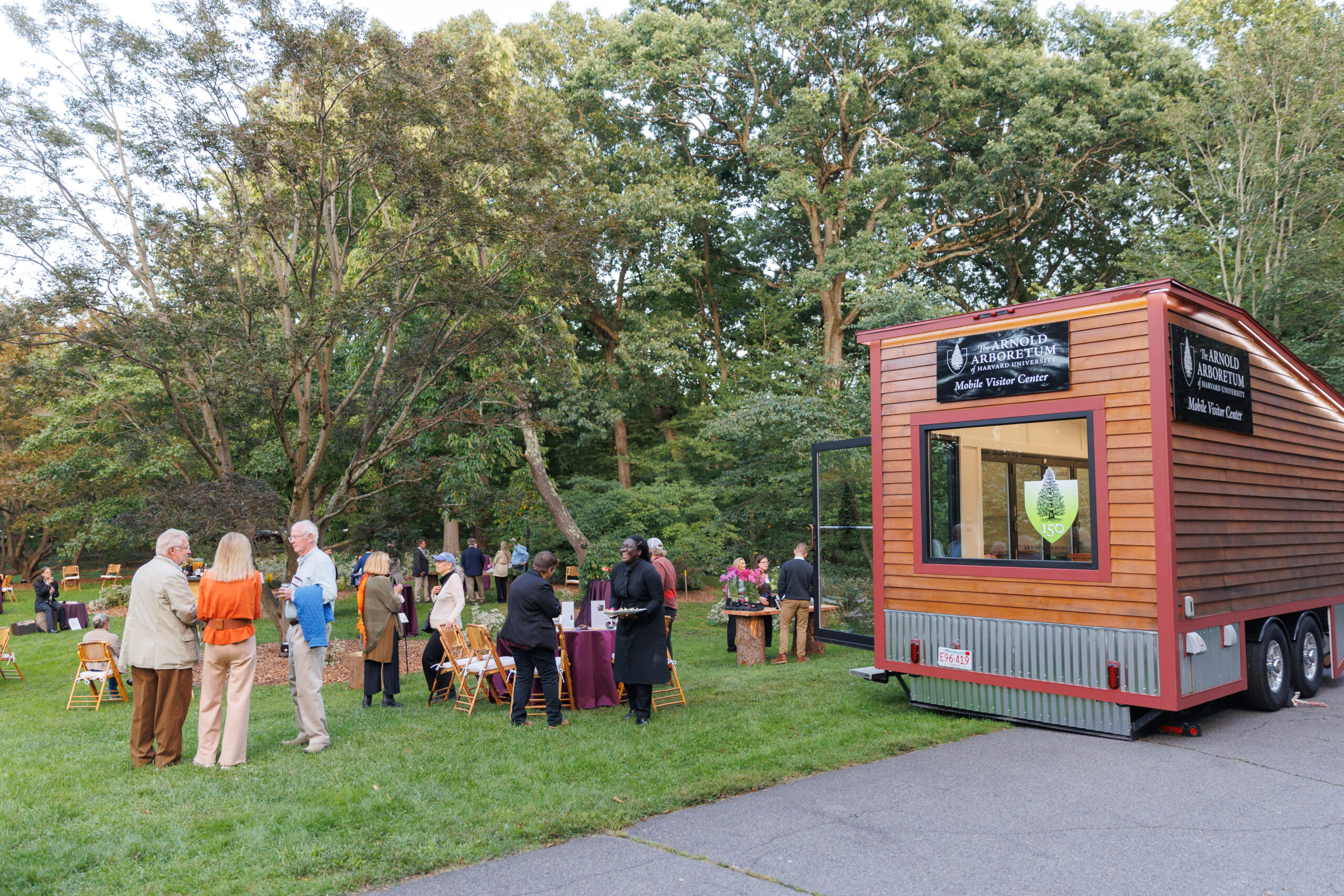 Guests gather in the maple collection near the Mobile Visitor Center at Magical Meanderings Autumn Dinner, September 19, 2023