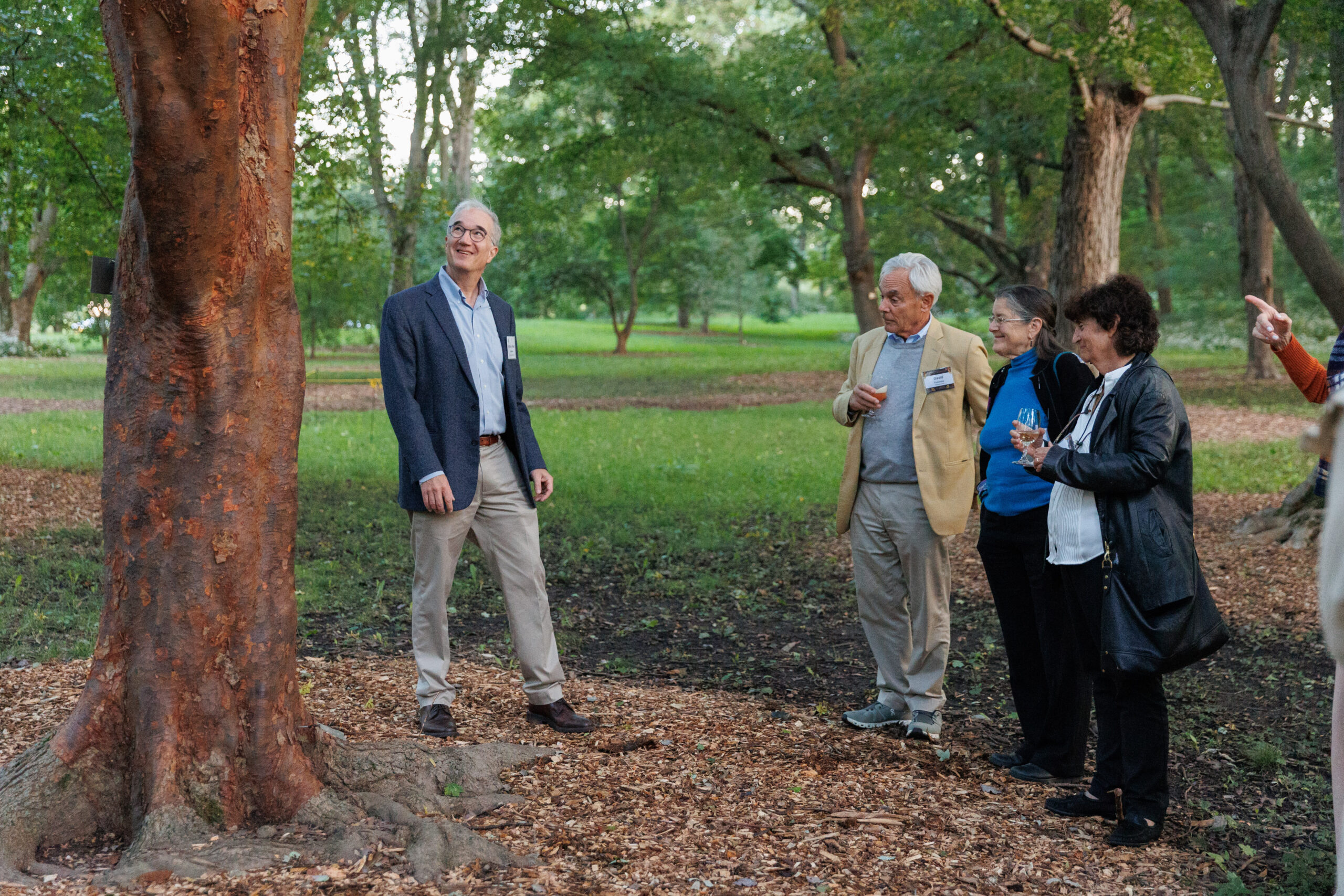 Guests enjoy a tour with Director Ned Friedman in the maple collection at Magical Meanderings Autumn Dinner, September 19, 2023
