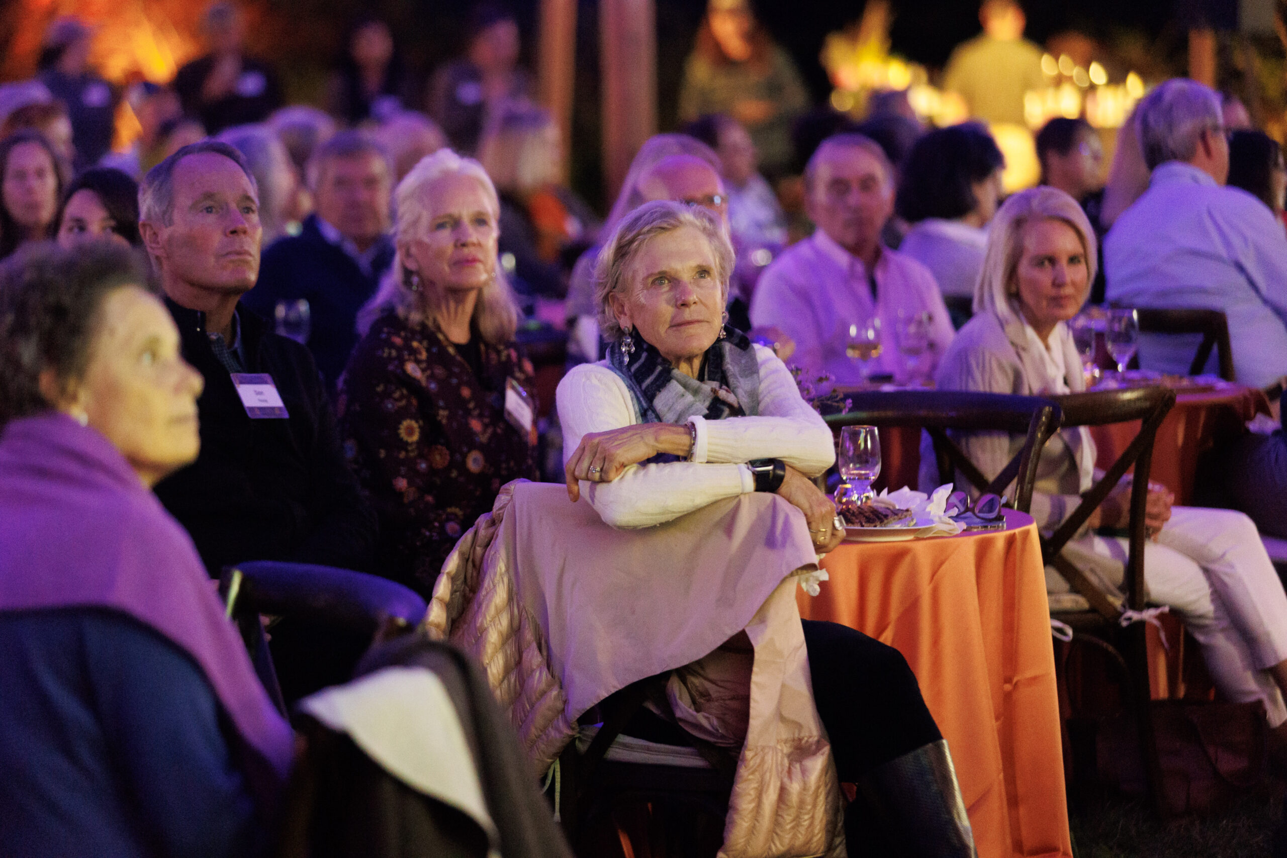 Guests listen to remarks under the event tent at Magical Meanderings Autumn Dinner, September 19, 2023