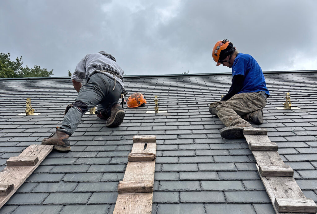 Work to restore the slate roof on the Hunnewell Building
