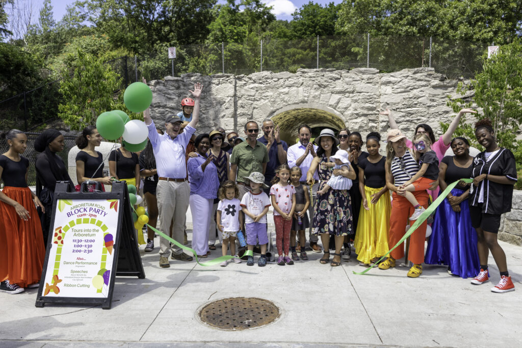 Mayor Michelle Wu cuts the ceremonial ribbon to officially open the new entrance to the Arnold Arboretum at Arboretum Road.