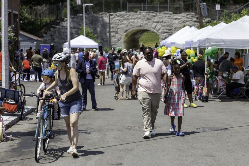 Neighbors and visitors enjoy festivities at a block party on July 19 to celebrate the opening of the new entrance to the Arboretum at Arboretum Road