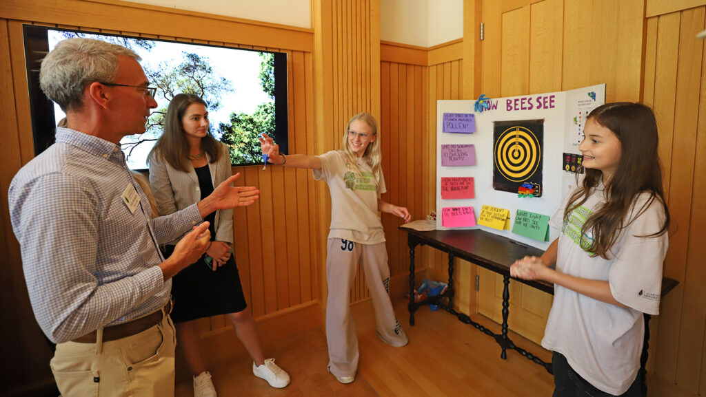 Arboretum Young Scientists present their science projects as part of the program's graduation event on August 1.
