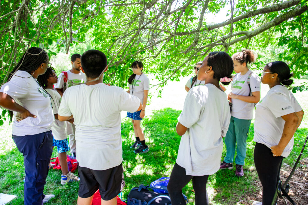 Arboretum Young Scientists and program coordinator Kareen WIlkinison at left in the Leventritt Shrub and Vine Garden.