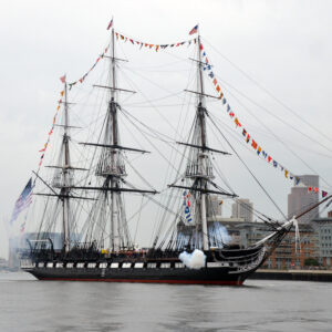 Large colonial ship in a harbor