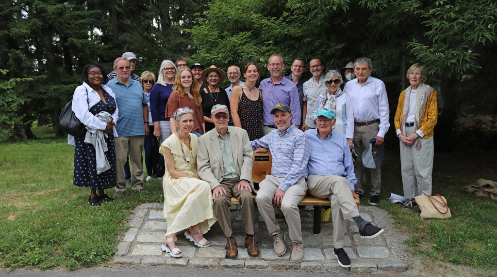 Friends and family gather for the dedication of a commemorative bench at the Arnold Arboretum